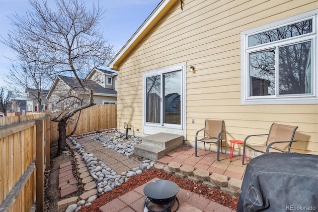 view of patio / terrace featuring fence