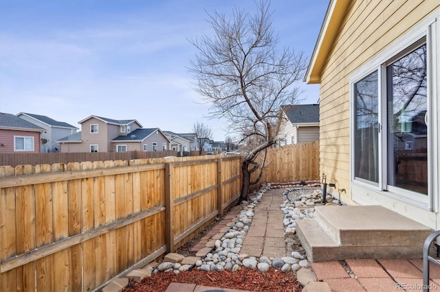 view of patio / terrace with a fenced backyard and a residential view