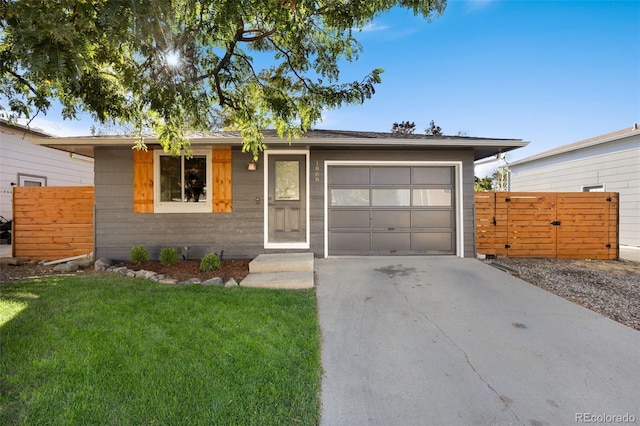 ranch-style house with a garage and a front yard