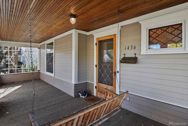 entrance to property featuring covered porch