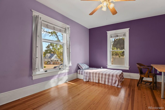 bedroom with hardwood / wood-style flooring and ceiling fan