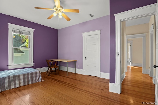 bedroom featuring light hardwood / wood-style floors and ceiling fan