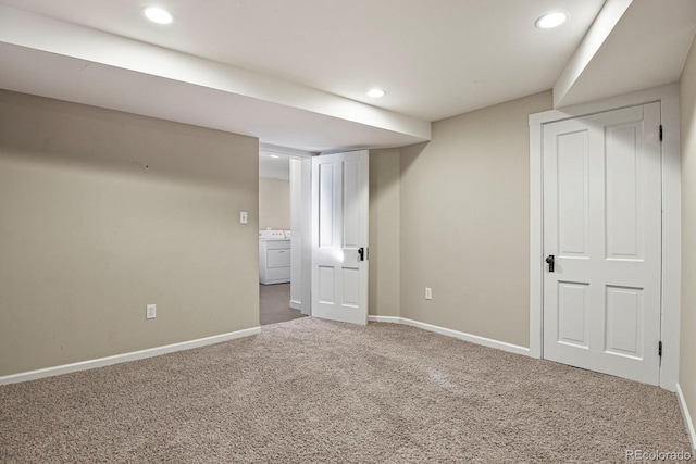 basement with washer / clothes dryer and carpet flooring