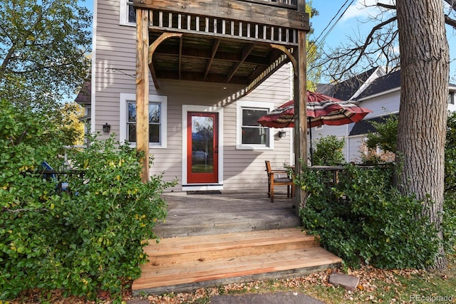 doorway to property featuring a wooden deck