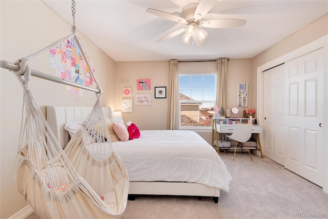 bedroom featuring a closet, ceiling fan, and carpet