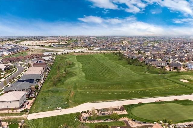drone / aerial view featuring golf course view and a residential view