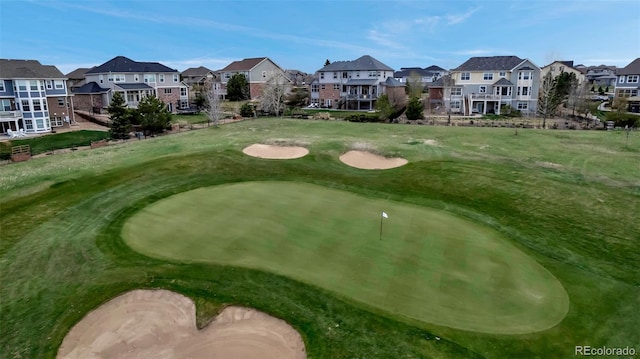 view of home's community featuring golf course view and a residential view