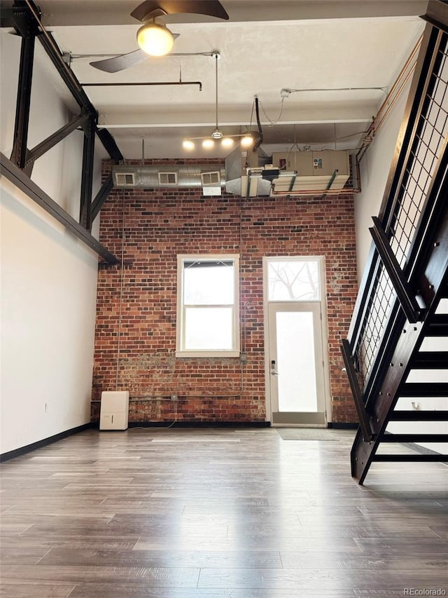 1111 Osage St Unit 7, Denver, CO 80204 - garage featuring baseboards and a ceiling fan