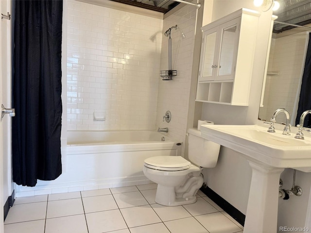 1111 Osage St Unit 7, Denver, CO 80204 - bathroom with toilet, shower / bath combo with shower curtain, tile patterned flooring, baseboards, and a sink