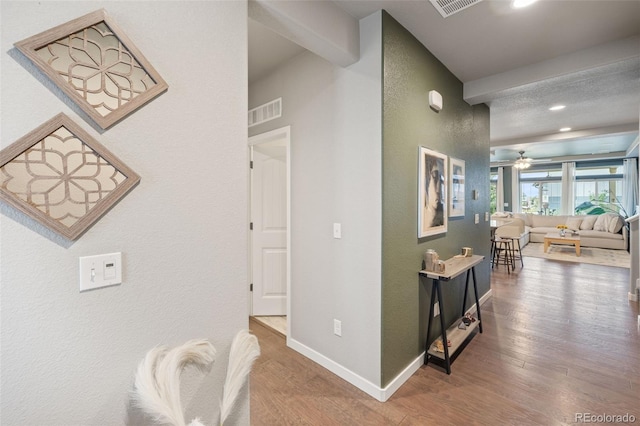 hall with hardwood / wood-style floors