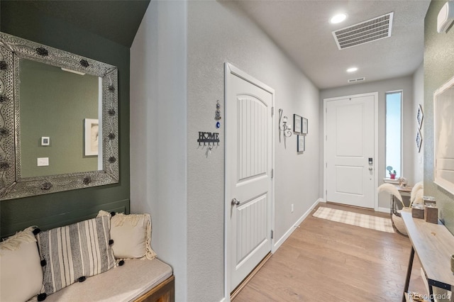 foyer entrance with light hardwood / wood-style flooring