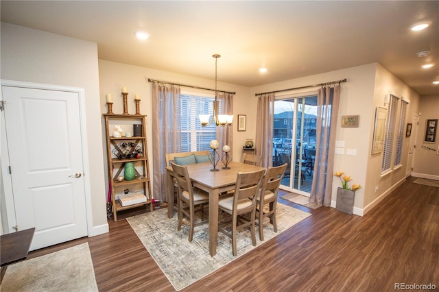 359 Courtfield Way, Castle Pines, CO 80108 - dining area featuring dark wood finished floors, a chandelier, baseboards, and recessed lighting