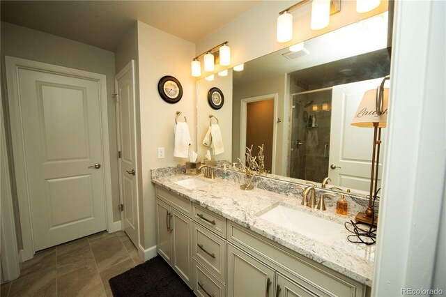 359 Courtfield Way, Castle Pines, CO 80108 - full bathroom featuring a shower stall, double vanity, and baseboards