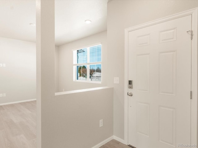 doorway with light wood-type flooring