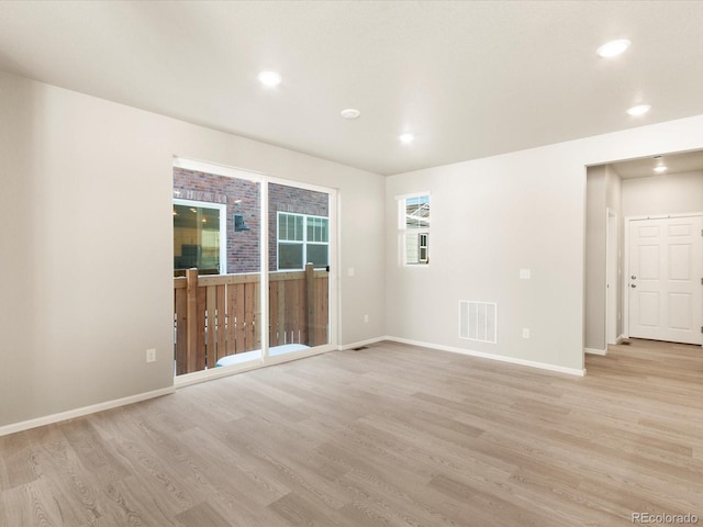 unfurnished room featuring light wood-type flooring