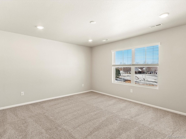 empty room featuring carpet floors