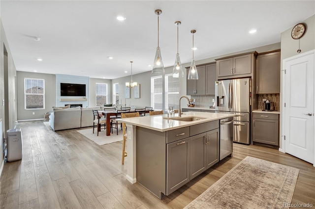 21436 E Stanford Ave, Aurora, CO 80015 - kitchen with a sink, appliances with stainless steel finishes, gray cabinetry, and light countertops