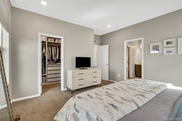 21436 E Stanford Ave, Aurora, CO 80015 - bedroom with a walk in closet, dark colored carpet, baseboards, visible vents, and a closet