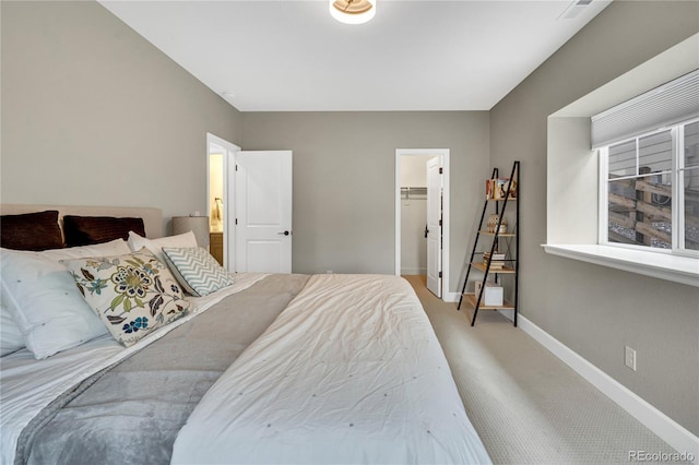 21436 E Stanford Ave, Aurora, CO 80015 - carpeted bedroom with baseboards, visible vents, and a walk in closet