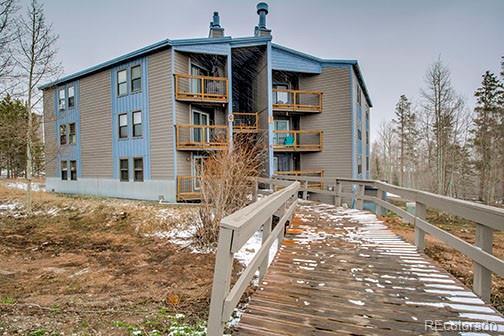 8500 Ryan Gulch Rd Unit 101, Silverthorne, CO 80498 - rear view of property featuring a chimney