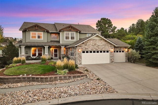 view of front of home with a garage and covered porch