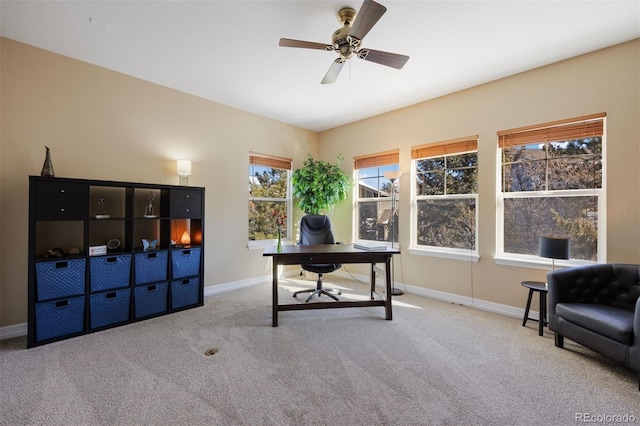 home office with ceiling fan and light colored carpet