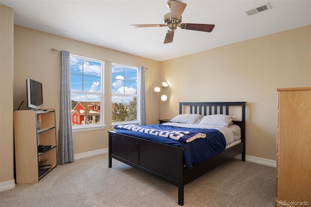 carpeted bedroom featuring ceiling fan