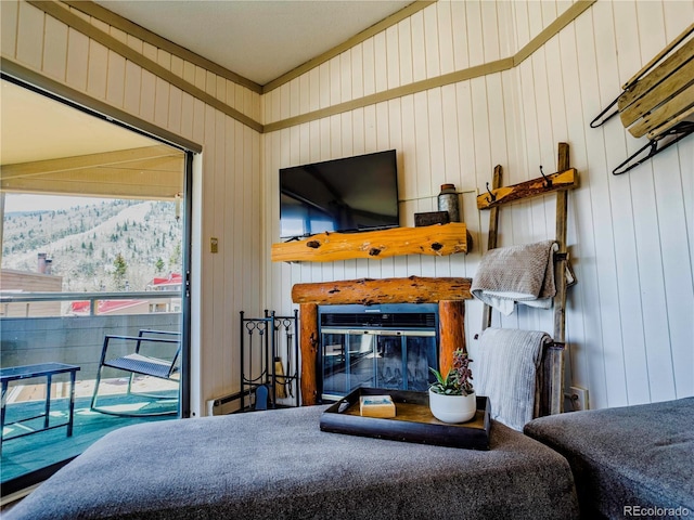 interior space with a glass covered fireplace