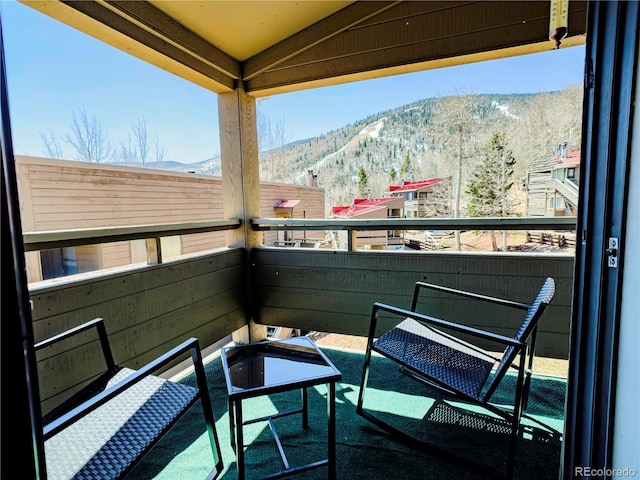 balcony featuring a mountain view
