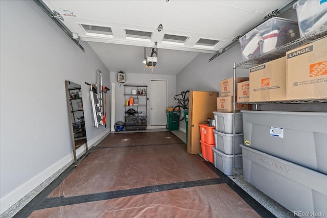 31191 Black Eagle Dr Unit 304, Evergreen, CO 80439 - garage featuring a garage door opener and baseboards