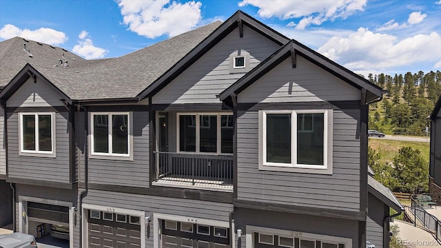 31191 Black Eagle Dr Unit 304, Evergreen, CO 80439 - view of side of home featuring a garage and a balcony
