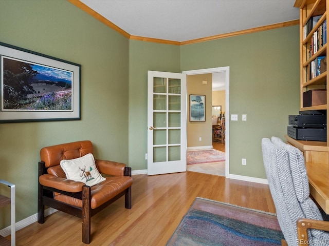 office with baseboards, ornamental molding, and wood finished floors