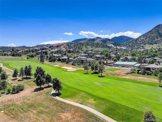 exterior space with a mountain view, golf course view, and a residential view