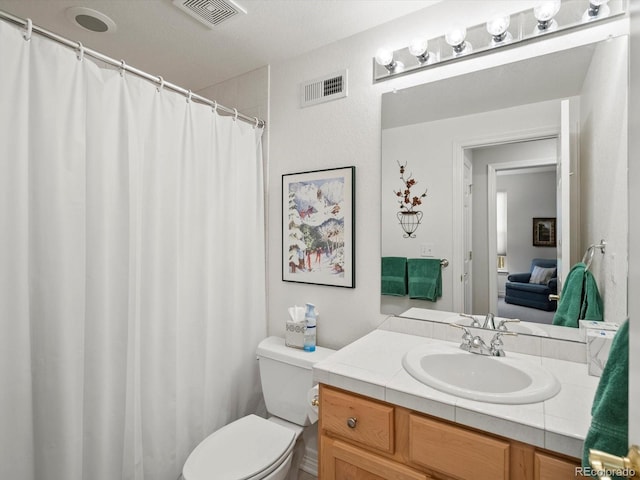 full bath with visible vents, a shower with shower curtain, toilet, and vanity