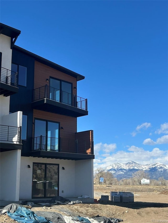 rear view of property with a mountain view