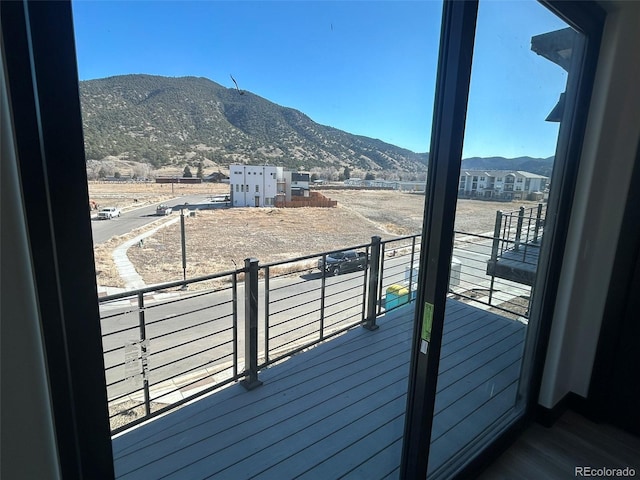 balcony featuring a mountain view