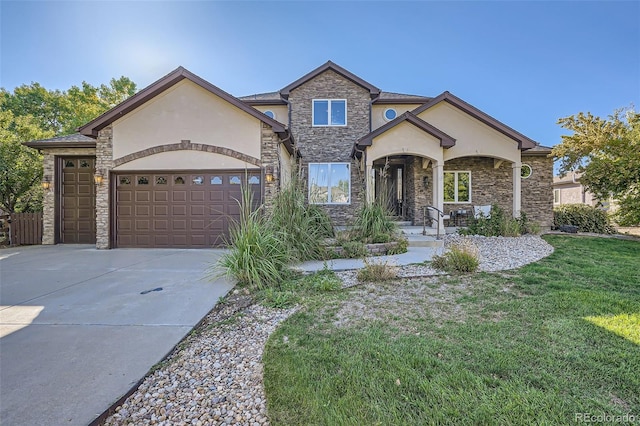 view of front of home with a garage and a front lawn