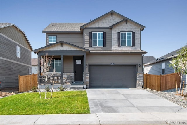 craftsman house with a garage, a porch, and a front lawn