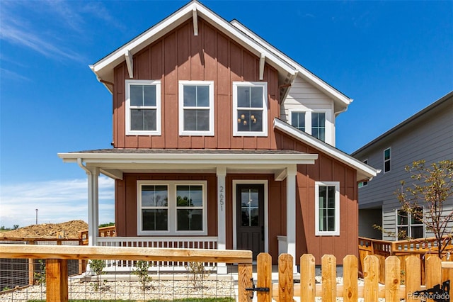 2651 E 102nd Pl, Thornton, CO 80229 - view of front of property featuring board and batten siding, a porch, and a fenced front yard