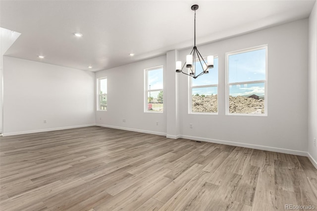 2651 E 102nd Pl, Thornton, CO 80229 - unfurnished room with recessed lighting, light wood finished floors, and a chandelier