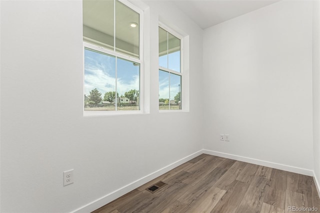 2651 E 102nd Pl, Thornton, CO 80229 - spare room featuring baseboards and wood finished floors