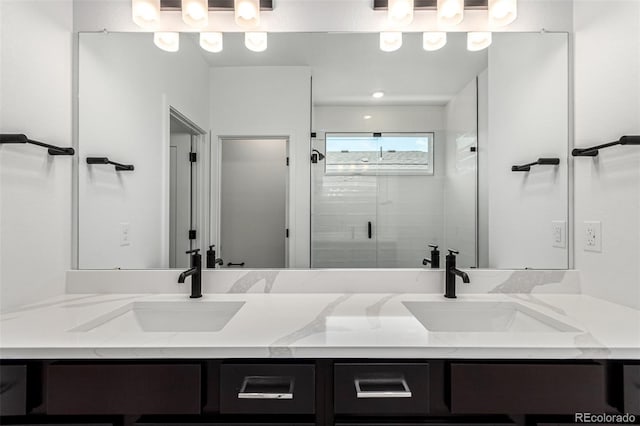 2651 E 102nd Pl, Thornton, CO 80229 - bathroom featuring double vanity and a shower stall