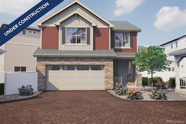 craftsman-style house with decorative driveway, stone siding, a garage, and board and batten siding