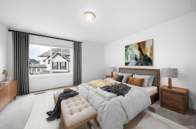 bedroom with light colored carpet and visible vents