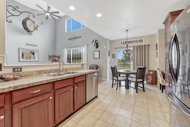 kitchen featuring dishwasher, ceiling fan, sink, light tile patterned flooring, and refrigerator