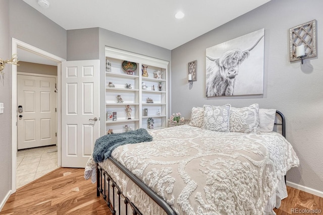 bedroom with light hardwood / wood-style floors