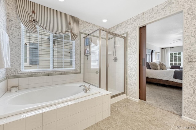 bathroom with tile patterned floors and separate shower and tub