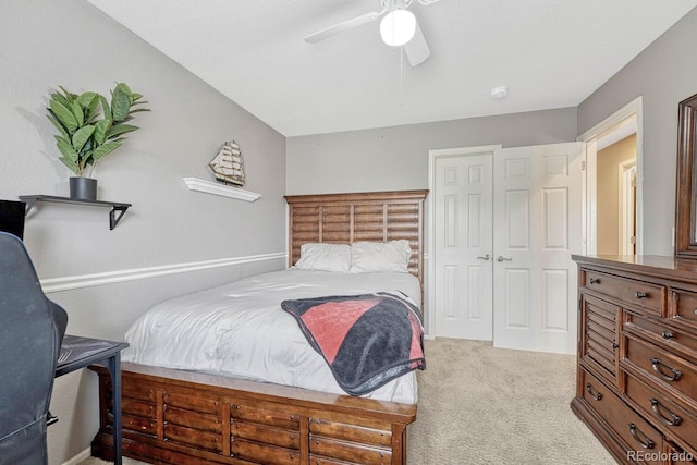 bedroom featuring ceiling fan, carpet flooring, and a closet