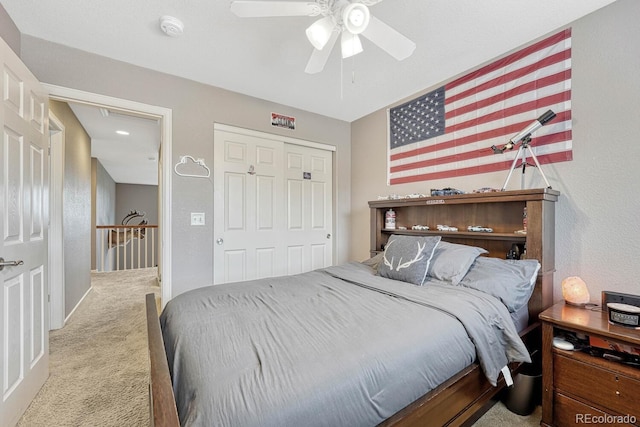 bedroom with a closet, ceiling fan, and carpet floors