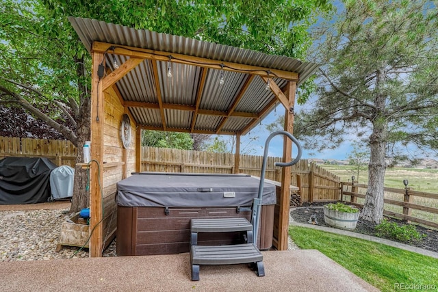 view of patio / terrace featuring a hot tub